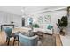 Stylishly decorated living room with a ceiling fan, neutral walls, and comfortable seating arrangement at 1549 Linwood Dr, Clearwater, FL 33755