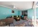 Comfortable covered patio with ceiling fan and ample seating, ideal for relaxing and entertaining outdoors at 1549 Linwood Dr, Clearwater, FL 33755