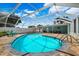 Stunning enclosed backyard pool with ample seating area offers ultimate privacy and comfort in Florida at 1549 Linwood Dr, Clearwater, FL 33755