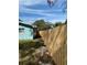 Side yard with wooden fence and access gate at 1549 Linwood Dr, Clearwater, FL 33755