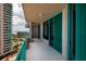Balcony with tiled floor, metal railing, and city and water views at 1560 Gulf Blvd # 1004, Clearwater Beach, FL 33767
