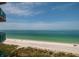 Ocean view from balcony overlooking beach and clear blue-green water at 1560 Gulf Blvd # 1004, Clearwater Beach, FL 33767