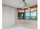 Bedroom with large windows offering scenic views and ample closet space at 1560 Gulf Blvd # 1004, Clearwater Beach, FL 33767