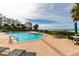 Pool area with lounge chairs and views of the beach at 1560 Gulf Blvd # 1004, Clearwater Beach, FL 33767
