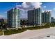 Stunning beachfront condo complex with pool, lush landscaping, and breathtaking ocean views at 1560 Gulf Blvd # 1004, Clearwater Beach, FL 33767