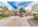 Community entrance with security gate and landscaping at 2506 N Rocky Point Dr # 356, Tampa, FL 33607