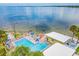 Relaxing waterfront pool area with lounge chairs and slide at 2506 N Rocky Point Dr # 356, Tampa, FL 33607