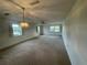 Spacious bedroom with carpet and window views at 1706 Belleair Forest Dr # 214, Belleair, FL 33756