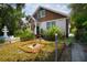 House exterior with brick border, landscaping and a fountain at 3022 Beach S Blvd, Gulfport, FL 33707