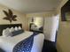 Bedroom with king-size bed and access to bathroom at 2506 N Rocky Point Dr # 356, Tampa, FL 33607