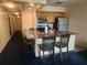 Kitchen with breakfast bar and stainless steel appliances at 2506 N Rocky Point Dr # 356, Tampa, FL 33607
