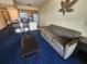 Living room with sofa and access to balcony at 2506 N Rocky Point Dr # 356, Tampa, FL 33607