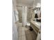 Bathroom with shower/tub combo and granite countertop at 2506 N Rocky Point Dr # 356, Tampa, FL 33607