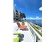 Relaxing waterfront deck with colorful lounge chairs at 2506 N Rocky Point Dr # 356, Tampa, FL 33607