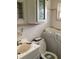 Bathroom with walk-in tub, toilet, sink, and vanity at 385 Dolphin Se Ave, St Petersburg, FL 33705