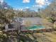 Home with private screened pool and lush landscaping at 10208 Grove Dr, Port Richey, FL 34668