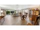 Bright living room with hardwood floors and ample natural light at 10208 Grove Dr, Port Richey, FL 34668