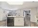 Modern kitchen with a large island and breakfast bar at 10208 Grove Dr, Port Richey, FL 34668