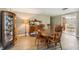 Antique dining set in bright dining room with wood flooring at 10208 Grove Dr, Port Richey, FL 34668