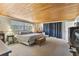 Spacious main bedroom with wood-look flooring and large windows at 10208 Grove Dr, Port Richey, FL 34668