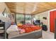 Spacious bedroom with wood ceiling and large windows at 10208 Grove Dr, Port Richey, FL 34668