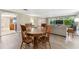 Open concept living room and dining area with wood-look floors at 10208 Grove Dr, Port Richey, FL 34668