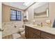 Bathroom with brown vanity, tile flooring, and shower/tub combo at 10208 Grove Dr, Port Richey, FL 34668