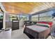 Bedroom with wood ceiling, window seat and large closet at 10208 Grove Dr, Port Richey, FL 34668