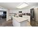 Kitchen features granite countertops and island at 10208 Grove Dr, Port Richey, FL 34668