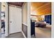 Long hallway with wood ceilings and access to bedrooms at 10208 Grove Dr, Port Richey, FL 34668