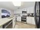 Kitchen with white cabinets, granite countertops, and double oven at 10208 Grove Dr, Port Richey, FL 34668