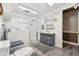 Bathroom with shower, vanity, and laundry hookups at 10208 Grove Dr, Port Richey, FL 34668