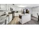 Bright kitchen with white cabinets and granite countertops at 10208 Grove Dr, Port Richey, FL 34668