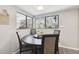 Bright dining area with a round table and four chairs, near the kitchen at 10208 Grove Dr, Port Richey, FL 34668