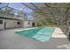 Screened-in pool with surrounding patio at 10208 Grove Dr, Port Richey, FL 34668