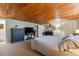 Large bedroom with wood ceiling, king bed, and plenty of storage at 10208 Grove Dr, Port Richey, FL 34668