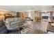 Spacious living room featuring hardwood floors and ample natural light at 10208 Grove Dr, Port Richey, FL 34668