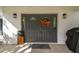 Double front doors with glass panels and autumnal wreath at 10208 Grove Dr, Port Richey, FL 34668