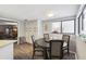 Bright dining area with a round table and four chairs, near the kitchen at 10208 Grove Dr, Port Richey, FL 34668