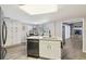 Kitchen with island, granite countertops, and stainless steel appliances at 10208 Grove Dr, Port Richey, FL 34668