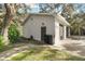 Detached garage with extra storage and a basketball hoop at 10208 Grove Dr, Port Richey, FL 34668