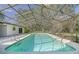 Large screened-in pool in backyard at 10208 Grove Dr, Port Richey, FL 34668