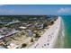 Sweeping aerial view captures the beachside community, ocean, and vibrant coastline at 2 4Th Ave, Indian Rocks Beach, FL 33785