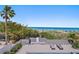 Views of the beach with a patio and sun loungers at 2 4Th Ave, Indian Rocks Beach, FL 33785