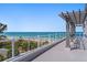 Enjoy panoramic ocean views from this expansive rooftop deck with a pergola at 2 4Th Ave, Indian Rocks Beach, FL 33785