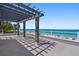 Expansive rooftop deck with a pergola and stunning ocean views at 2 4Th Ave, Indian Rocks Beach, FL 33785