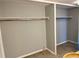 Open closet area with rod and shelf provides ample storage space at 7200 Sunshine Skyway S Ln # 7E, St Petersburg, FL 33711