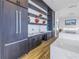 Modern dark wood kitchen with white quartz counters at 777 3Rd N Ave # 1204, St Petersburg, FL 33701