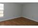 Bright bedroom with hardwood floors and large window at 201 Cypress Pond Rd # 201, Palm Harbor, FL 34683