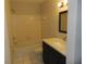Bathroom with updated vanity and shower/tub combo at 201 Cypress Pond Rd # 201, Palm Harbor, FL 34683